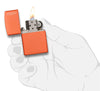 Classic Orange Matte Zippo Logo Windproof Lighter lit in hand