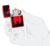 Zippo Flame Logo Design Metallic Red Windproof Lighter lit in hand